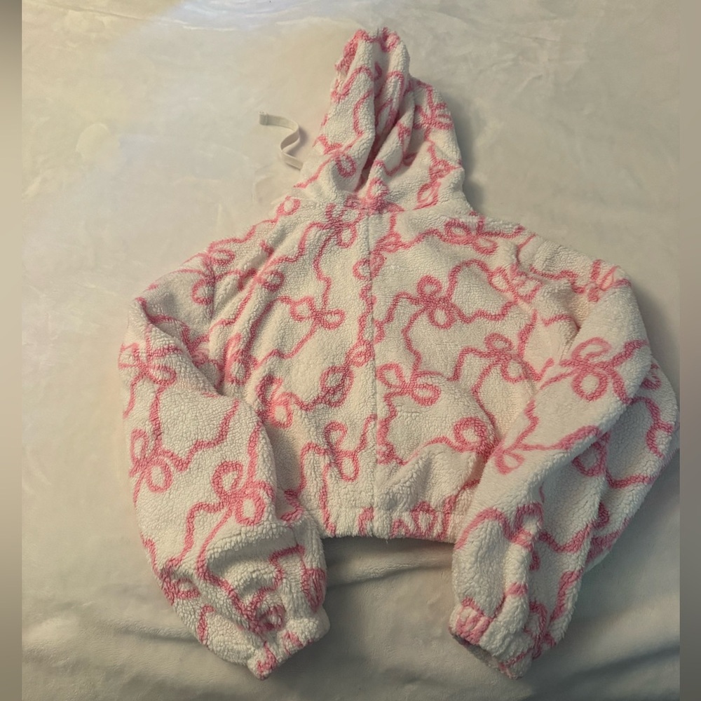 Love Shack Fancy Darcelle Bomber Jacket. White Sherpa Zip with Pink Bow Pattern